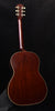 Acoustic guitar back view with glossy dark wood body and cream edge binding