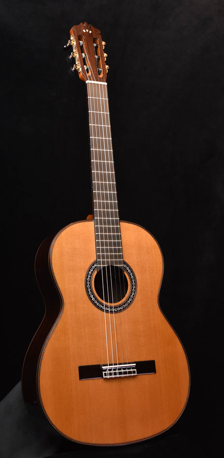 Classical nylon-string guitar with natural wood body and rosette sound hole