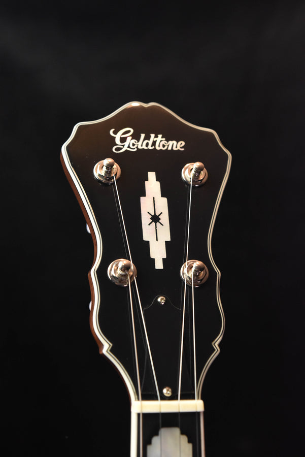 Gold Tone five-string banjo headstock with tuning pegs and logo, brown finish