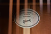 Acoustic guitar neck block with “GUARANTEED” and Gibson name label