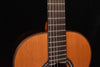 Classical guitar close-up of rosette sound hole and bridge strings
