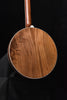 Brown wooden banjo body with white binding and upright neck