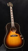 Sunburst acoustic-electric guitar with cutaway body and dot inlays