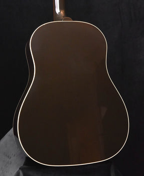 hollow-body acoustic guitar body with dark top and white binding outline