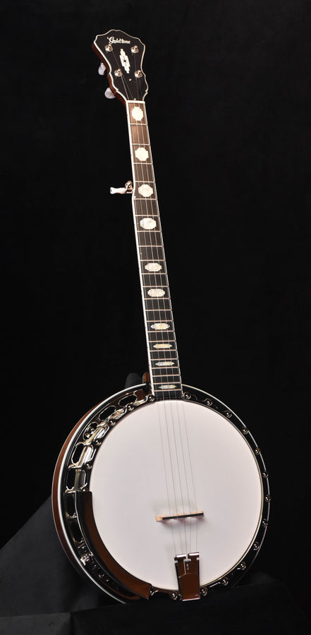 Five-string banjo with white head and dark metal rim, full instrument view