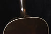 Acoustic guitar top with neck joint and glossy finish, shown from below