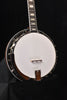 Banjo with white drumhead, dark metal rim, and neck with frets and strings