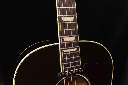 fretboard and headstock of sunburst acoustic-electric guitar with dot inlays
