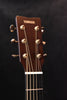 Yamaha headstock of acoustic guitar with gold tuning machines