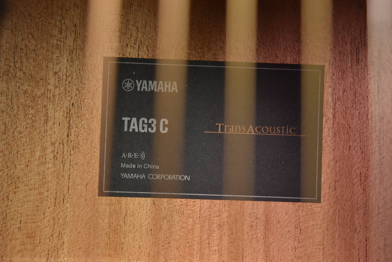 TAG3 C TransAcoustic label on guitar back