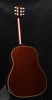 Natural wood acoustic-electric guitar with cream binding and headstock