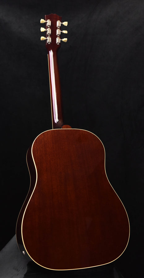 Natural wood acoustic-electric guitar with cream binding and headstock