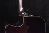 Neck-to-body joint on dark-finished acoustic guitar