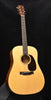 Gloss dreadnought acoustic guitar with natural wood body and front sound hole