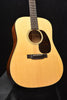 Gloss dreadnought acoustic guitar front view with rosette and bridge area