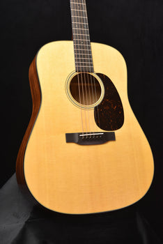gloss dreadnought acoustic guitar front view with rosette and bridge area