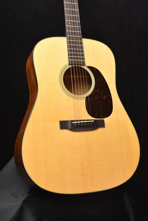 Gloss dreadnought acoustic guitar front view with rosette and bridge area