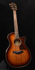 Red-brown sunburst acoustic guitar with cutaway body and tortoiseshell pickguard