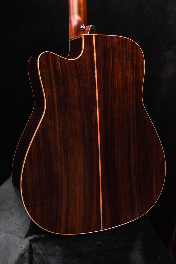 Front view of acoustic/electric guitar body with single round soundhole and natural top