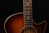 Acoustic guitar neck and upper bout with bound edge and fretboard inlay