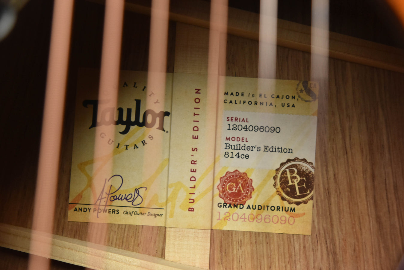 Acoustic guitar inside labels on the wood body near the soundhole