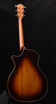 acoustic guitar back view in red-brown finish with bound outline