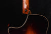 Acoustic guitar side view with neck joint and glossy wood binding
