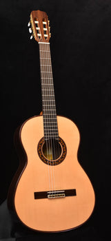 jose ramirez classical guitar with spruce top, single cutaway shape, and rosette sound hole