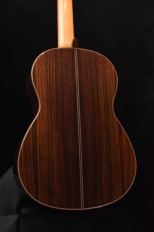 Jose Ramirez classical guitar back view with dark wood grain and center line