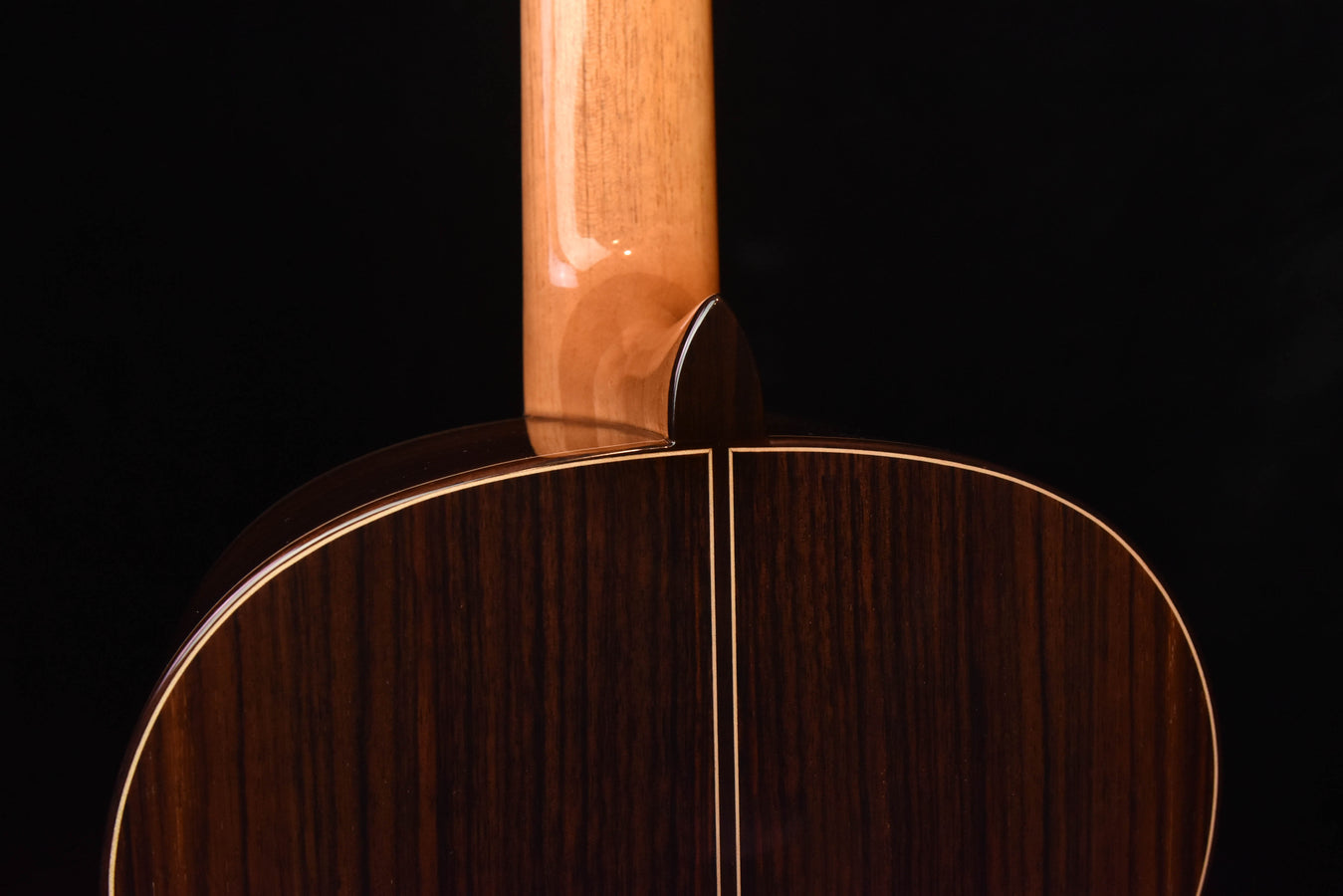 Jose Ramirez classical guitar top close-up with spruce wood and black neck joint