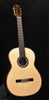 Light wood classical acoustic guitar with rosette sound hole and black bridge