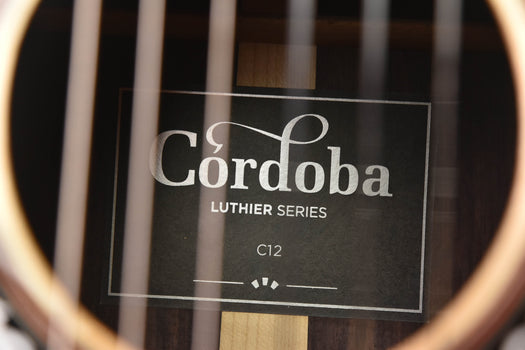 cordoba luthier series c12 label on the guitar top