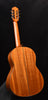 Cordoba parlor classical guitar side view with arched back and tuning pegs