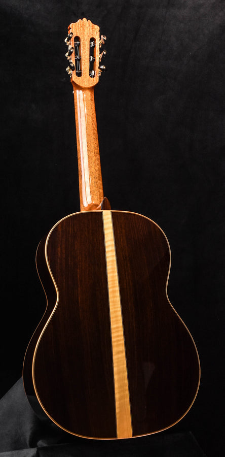 Dark wood classical acoustic guitar back with light center stripe