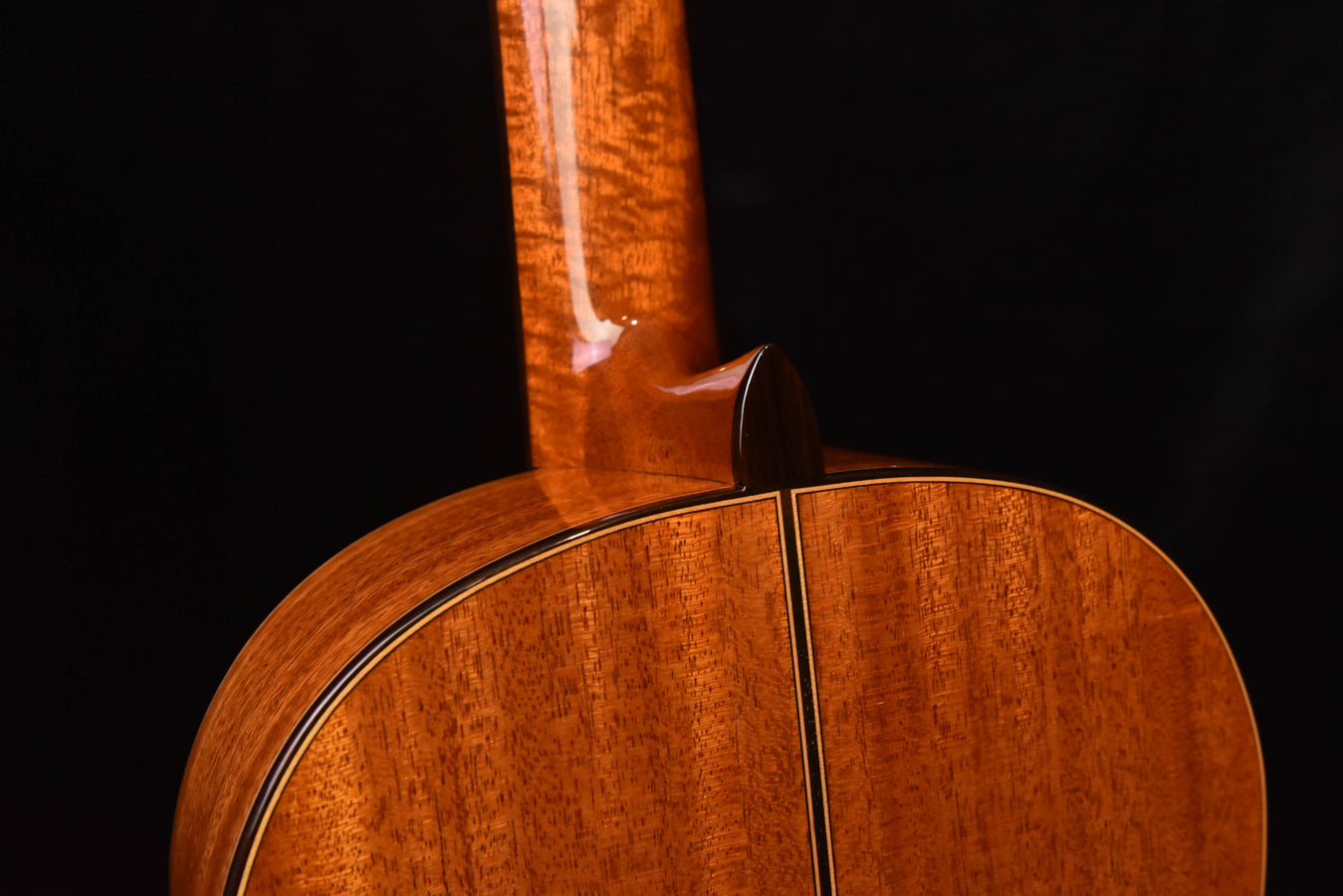Cordoba classical guitar top edge detail with curved trim and rosette