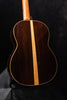 Dark wood classical acoustic guitar back with light center seam