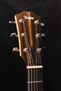 Taylor acoustic guitar headstock with tuning pegs and logo