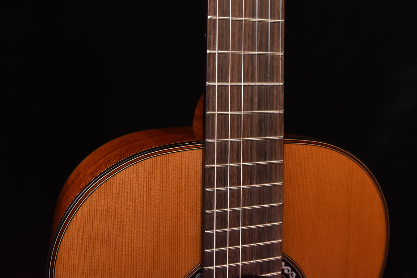 Classical guitar fretboard and strings close-up
