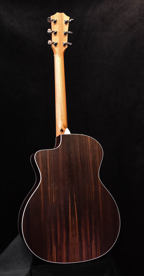 Acoustic guitar back with dark wood finish and light binding