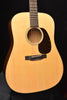 Front view acoustic guitar with round soundhole and dark pickguard