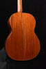 Classical guitar back view showing central seam and wood grain