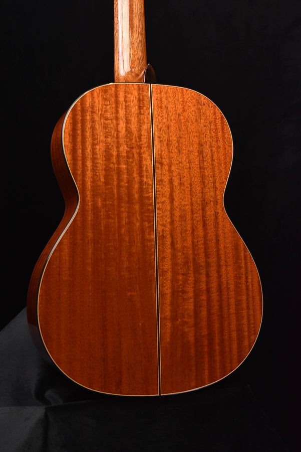 Classical guitar back view showing central seam and wood grain