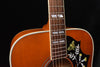 Dreadnought acoustic guitar with fretboard and hummingbird inlay on pickguard