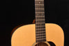 Neck and upper bout of Super D-18 acoustic guitar with fretboard and strings