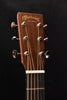 Headstock of Super D-18 acoustic guitar with tuning machines and logo