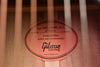 Gibson branded soundboard label with “Guaranteed quality and craftsmanship” text