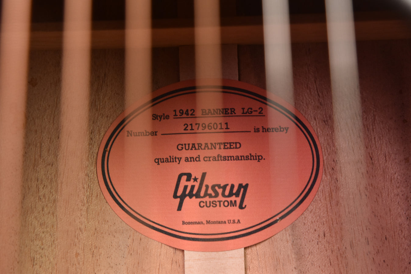 Gibson branded soundboard label with “Guaranteed quality and craftsmanship” text