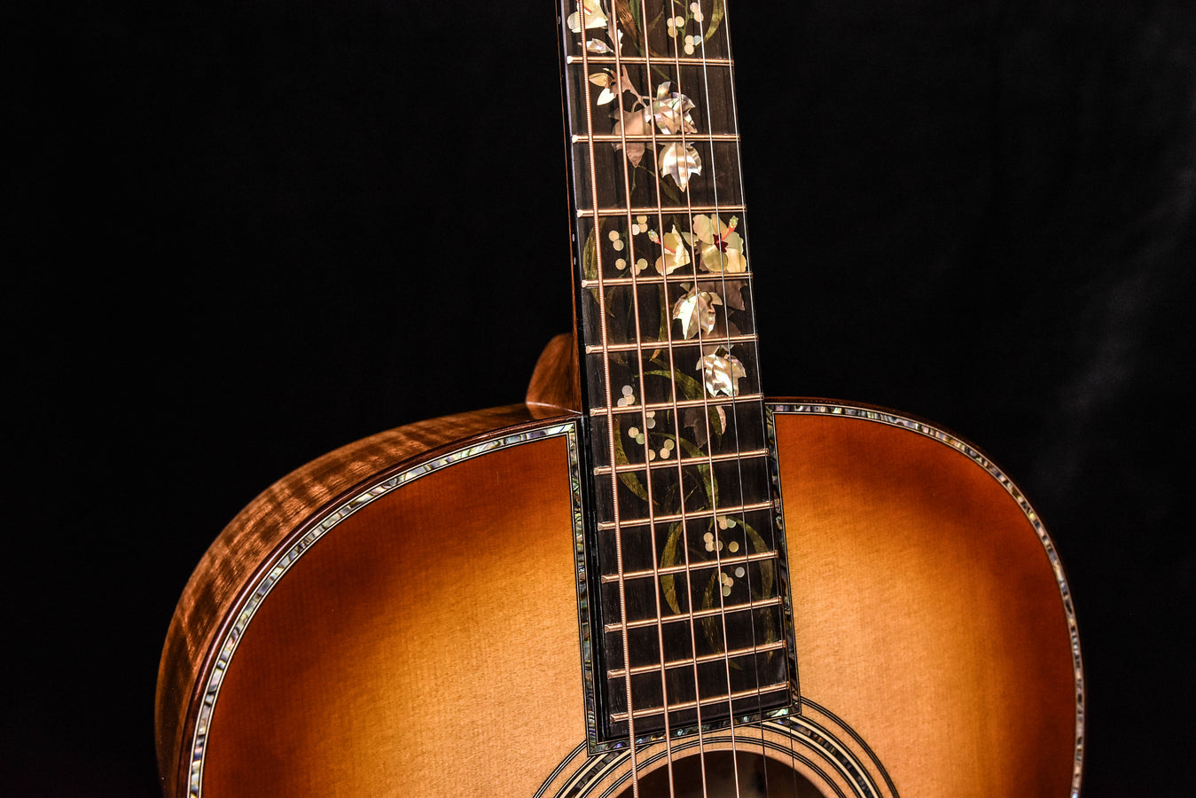 Martin O'ahu K-42 Hibiscus acoustic guitar neck and upper bout close-up with binding