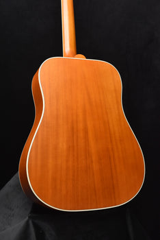dreadnought acoustic guitar back in warm wood tone with white edge binding