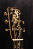 Martin O'ahu K-42 Hibiscus acoustic guitar headstock with flower inlay and tuning pegs